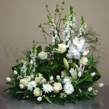 The flowers you choose can be the same or similar to the ones for a traditional funeral. 64 Urn Floral Arrangements Ideas Floral Arrangements Urn Arrangements Arrangement