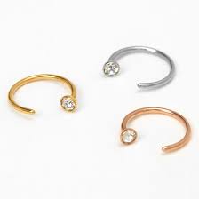 By placing the pliers through the ring and very gently opening them until the ball is released. Mixed Metal 20g Crystal Open Hoop Nose Rings 3 Pack Claire S Us
