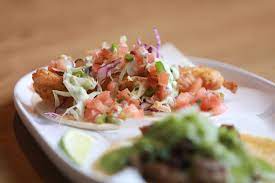 Crispy cod medallions on a bed of shredded cabbage with a chili lime allioli. Columbus Taco Trucks And Restaurants To Try