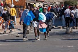 Rioting broke out in deprived areas of cape town where millions are currently confined to crammed townships. H5axgbd05ufcpm