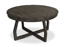 Made from reclaimed elm wood, the plank coffee table has a solid silhouette that's deceptively light—a hollow interior makes it easy to move around. Hayden Round Coffee Table Hom Furniture