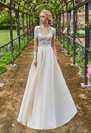 A Line Dress With Long Sleeves And Closed Back Buttons Zipper The Corset Ma Long Sleeve Wedding Dress Lace Lace Wedding Dress With Sleeves Wedding Dresses