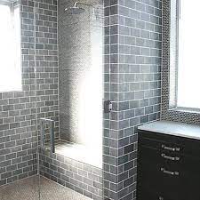 For smaller bathrooms, you may choose to steer away from contrasting tiles and go for a large, clean tile as this can give the illusion of a more spacious bathroom. Http Ahomedesigns Net Wp Content Uploads 2011 11 Bathroom Shower Tiles Designs Jpg Glass Tile Bathroom Bathroom Tile Designs Glass Bathroom