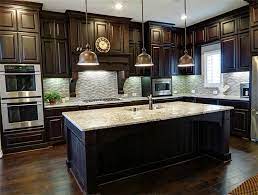 Another standout feature of this kitchen is its coat of rich orange paint, which beautifully complements the tone of the wood. 31 Best Kitchens With Dark Cabinets Wood Floors Ideas Kitchen Remodel Kitchen Design New Kitchen