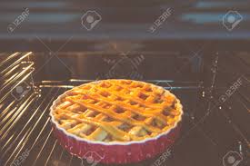 fresh baked golden apple pie in red