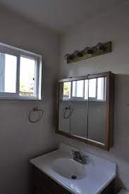 Updating A Bathroom Medicine Cabinet Bathroom Mirror Makeover Bathroom Medicine Cabinet Mirror Bathroom Medicine Cabinet