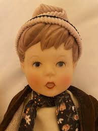 Hi, Can anyone offer any advice about these two dolls please. Doll  measurements: 22cm high They are all porcelain. And are held together  (arms, legs, head by some kind if string inside