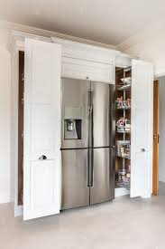 A Beautiful Standalone Fridge Freezer Sits Here With Modern Storage Solutions Either Side Pull Out Modern Storage Shaker Style Kitchens Kitchen Pantry Design