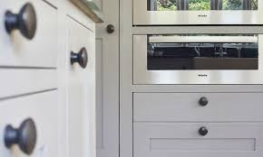 This impeccable dark grey shaker style kitchen brings a classic concept bang up to date. Mid Grey Shaker Kitchen Chidingfold Kitchens