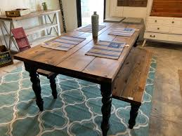 The table has the perfect round farmhouse style legs and planked top. Rustic Farmhouse Table Set With Turned Legs Two Benches Provincial Brown Top And Black Painted Base Dining Set Modern Design
