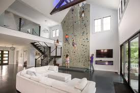 A bouldering wall is constructed in much the same way as a wood framed house: This Family Put A 26 Foot Rock Climbing Wall In Their Living Room