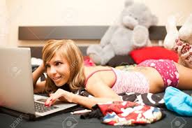 Most of the time the breast enlargement amounts to a firm. Young Teen Blond Woman In Bed In Chaos Of Clothes With Laptop Stock Photo Picture And Royalty Free Image Image 6017143