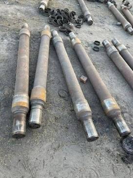 Forged railway axle shafts prior to machining, AI generated