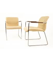 Relax in style with a natural wood frame and a white sheep skin inspired fabric covering cushions. Mid Century Chrome And White Upholstery Lounge Chairs With Leather Wrap Armrest Pair