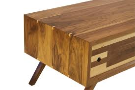 This dark, honey colored coffee table is made of wood and possesses a simple charm. Mid Century Solid Walnut Wood Coffee Table Open Door Furniture