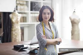 Choose from thousands of latest styles and trends. Female Asian Fashion Designer In Studio With Crossed Arms Textile Industry Tape Measure Stock Photo 178412194