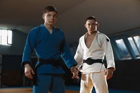 To help you better understand the judo belts and what is judo, we have prepared a comprehensive guide for you below. Free Photo Two Young Judo Caucasian Fighters In White And Blue Kimono With Black Belts Posing Confident In The Gym Strong And Healthy Practicing Martial Arts Fighting Skills Overcoming Reaching Target