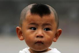 A Young Chinese Boy Sports A Traditional Hairstyle Chinese Hairstyle Traditional Hairstyle Boy Haircuts Short