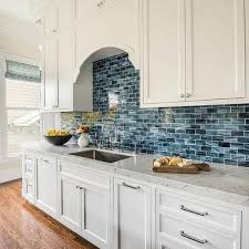 White Kitchen Cabinets With Blue Mini Brick Backsplash Tiles Kitchen Backsplash Designs Backsplash Kitchen White Cabinets Blue Tile Backsplash Kitchen