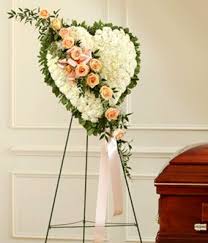 They have relatively cheap prices and a large selection of beautiful flowers. White Flower Standing Heart With Peach Roses At From You Flowers Funeral Floral Arrangements Funeral Floral Peach Roses
