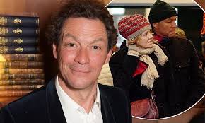 Bleary-eyed Dominic West is 'helped into his hotel by a female pal after  partying till 4am'