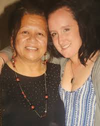 Hi everyone, could anyone make this pic of my mum any clearer pleaee,  thanks, thanks!