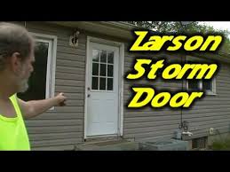 A storm door looks great on this high end home! Larson Storm Door With Dog Passage Youtube