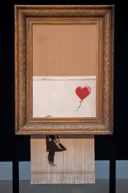 Along with a picture of stunned onlookers as the shredded art emerges from the bottom of the frame. Banksy Could Face Prosecution For Shredding Artwork After It Sold For 1m At Auction