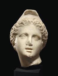 AN ETRUSCAN BRONZE VESSEL HANDLE , CIRCA 475-450 B.C.