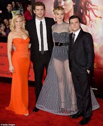 Her height is 1.75 m or 5.74 feet and her weight is 139 pounds or 63 kilograms. Jennifer Lawrence Towers Above Josh Hutcherson At La Premiere As Film Posters Prove Deceptive Daily Mail Online