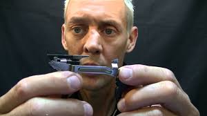 How do you adjust the striker/cruciform engagement?