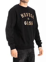 We are a movement, a revolution, a call to action. The Hustle Gang Face Off Crew Sweatshirt In Black Gold Instockshowroom