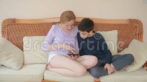 Mom and Her Son Teenager Speak Well, Look at the Tablet Touch the Touch  Screen Stock Footage - Video of happy, cute: 89957190