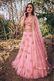 Get In Touch With Your Feminine Side Wearing Pink Coloured Lehenga Choli By Ninecolours Made Indian Wedding Reception Outfits Bollywood Dress Indian Outfits