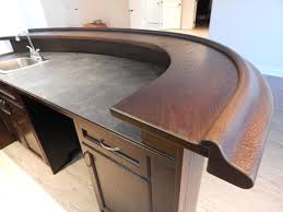 Well you're in luck, because here they come. Solid Oak Bar Top And Bar Rail With Laminate Counter Top Sink Faucet Space For Bar Fridge Countertops Kitchen Countertops Inexpensive Countertops