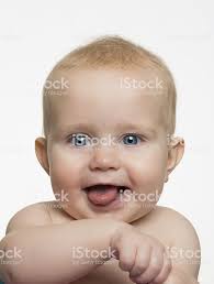 Bright Eyed Baby Sticking Tongue Out Stock Photo Download Image Now Istock