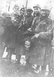 Croatian Ustaše soldiers pose with the severed head of a Serbian villager  in Banja Luka, February 1942 (1418x2037) : rHistoryPorn