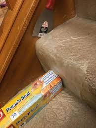 If you are not taking out the carpet, then simply paint the spindles white and leave the handrail wood. Paint Baseboard Of Stairs Without Messing Up Your Carpet Painting Baseboards Painting Trim Diy Home Repair