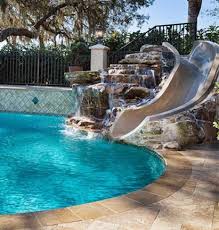 Custom Swimming Pool In Tanglewood Traditional With Natural Rock Built In Slide And Raised W Custom Swimming Pool Pools Backyard Inground Swimming Pool House