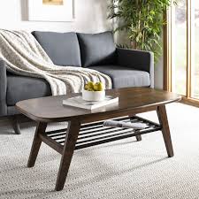 Add style to your home, with pieces that add to your decor while providing hidden storage. Safavieh Home Oren Mid Century Modern Walnut And Black 2 Tier Coffee Table Buy Online In Angola At Angola Desertcart Com Productid 132325830