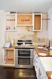 Raise Microwave Cabinets Our Diy Under The Cabinet Cook Book Holder Kitchen Inspirations Diy Kitchen Shelves Kitchen