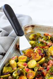 Once brussels sprouts are done cooking, add bacon and drizzle with maple syrup. Maple Bacon Roasted Brussel Sprouts Bake Eat Repeat