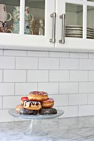 Once completely dry, take the cloth and wipe away any remaining grout film from the backsplash tiles. Subway Tile Backsplash Installation Nest Of Posies