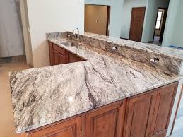 Solid surfaces have several positives. Thunder White Granite Countertops Kitchen Seattle By Tops Solid Surface Houzz