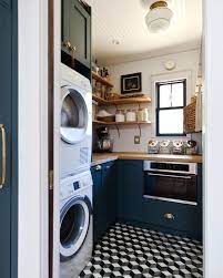 Navy Kitchen With A Stunning Built In Navy Kitchen Pantry Laundry Room Laundry Room Design