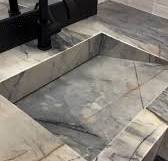 Gorgeous Ijen Blue Quartzite bathroom vanity with sloped drain fabricated  by @sierrastoneinc!, Also featured: Flash White 5”x5” and S-Series Canvas  White Scallop