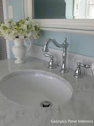 The look of marble without the maintenance. Carrera Marble Counters Transitional Bathroom Georgica Pond Interiors