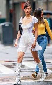 The 24 year old was in town to check out dior's menswear show and for the event, hadid wore a pair of green snakeskin pants that matched with her bag. 20 Little White Dresses To Shop Now From Luxe With Love Bella Hadid Outfits Fashion Bella Hadid Street Style