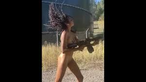 Ebony chick plays with her huge at gun