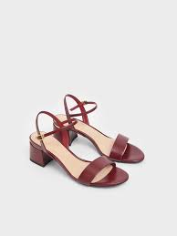 A graceful ankle strap, recalling the world of beautiful dancers and choker necklaces, is anchored with two thin straps reaching around and under. Red Open Toe Ankle Strap Block Heel Sandals Charles Keith De